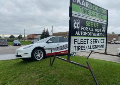 White Tesla on the Street - The Kar Doctor - Car repair London Ontario